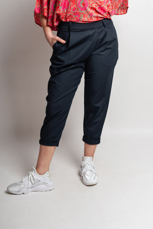 Pantaloni asimmetrici a pieghe Margret